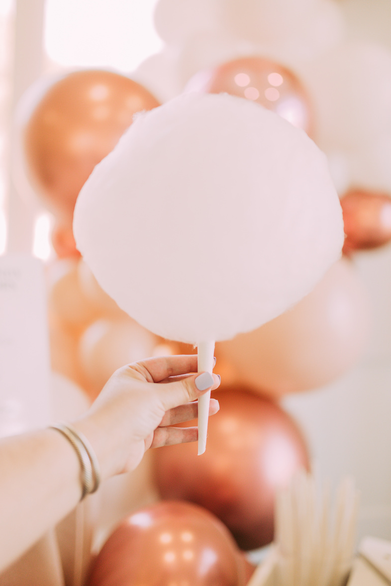 Person Holding a Cotton Candy 